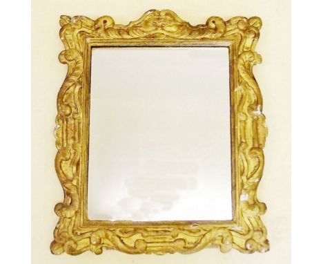 A Georgian style gilt framed carved wood and gesso easel mirror with scrollwork and mask decoration - 60 x 51cm 