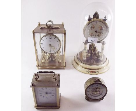 A floral decorated tortion clock, a gilt tortion clock and two other clocks 