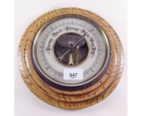 An oak cased circular barometer 