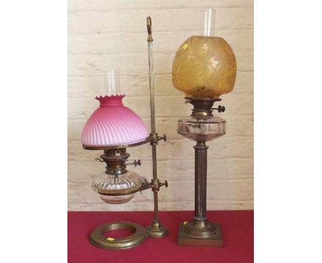 Reeded brass column oil lamp and an adjustable brass desk oil lamp. Condition report: see terms and conditions.