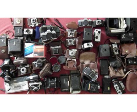 Two boxes containing 33 vintage cameras including Nikon, Cannon, Minolta, Kodak brownies, etc Condition report: see terms and