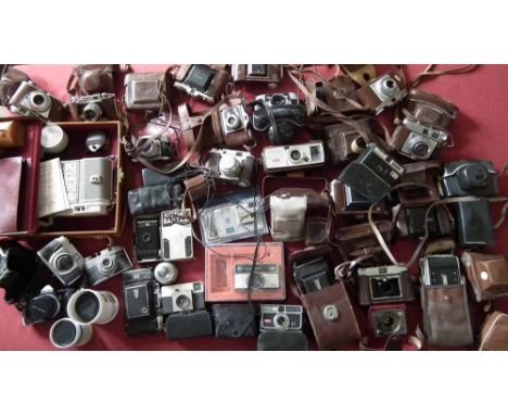 Two boxes containing 36 vintage cameras including Olympus OM1, Zeiss Ikon, Kodak, Ilford etc Condition report: see terms and 