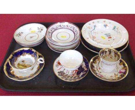 Collection of early 19th century porcelain including two cups and saucers, tea bowl and saucer, various other saucers, plate 