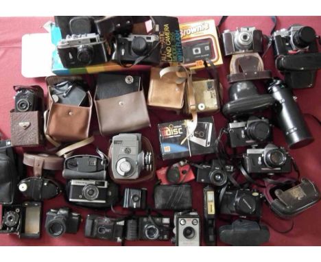 Two boxes containing 27 vintage cameras including Kodak , Minolta, Zorki, Topcon, etc Condition report: see terms and conditi