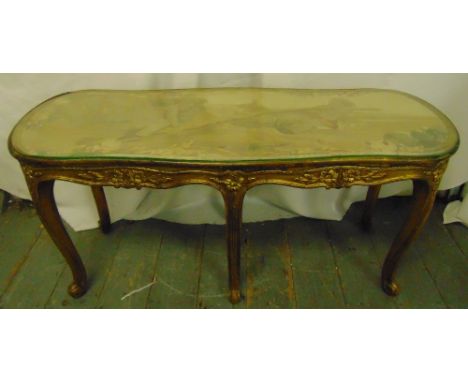 A salon table rounded rectangular carved gilt wood sides and cabriole legs with tapestry top