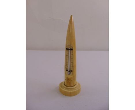 A marine ivory stand inset with a mercury thermometer on raised circular base