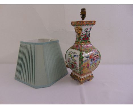 A late 19th century Cantonese vase decorated with flowers and leaves, converted to a table lamp, to include silk shade