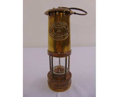 A miners brass Davy lamp by E. Thomas and Williams Ltd, no 229510