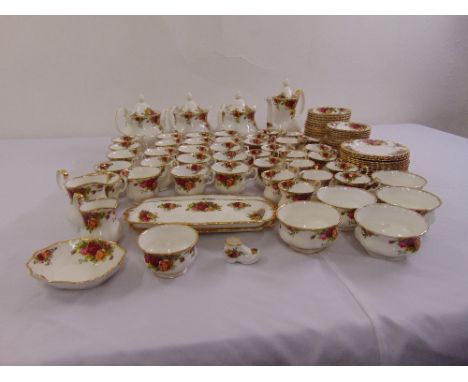 Royal Albert Old Country Roses tea service to include cups, saucers, plates, cake plates, teapots, sugar bowl and milk jug (1