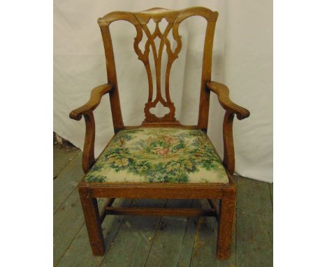 A George III mahogany childs chair with pierced splat, tapestry seat on four rectangular legs