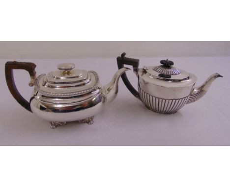 A Regency silver teapot with gadrooned rim on four lion claw feet, Charles Price London 1819 and a Victorian teapot with part