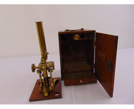 J.H. Steward brass microscope in fitted wooden case, to include twenty-five prepared slides