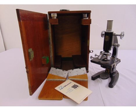 C. Baker a microscope in fitted wooden case, to include additional lenses