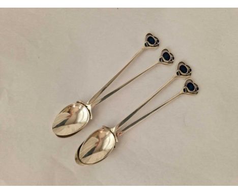 A set of four stylish Danish silver and enamel spoons by HL