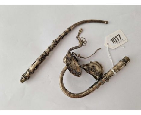 A Middle Eastern white metal pipe with bird decoration, 2" long