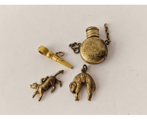 A yellow metal flask charms and watch key