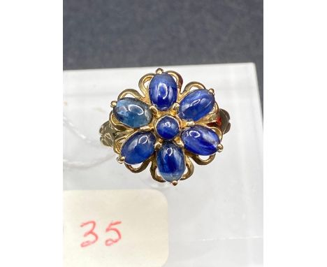 A 1960s flower cluster dress ring set with cabochon sapphires 9ct