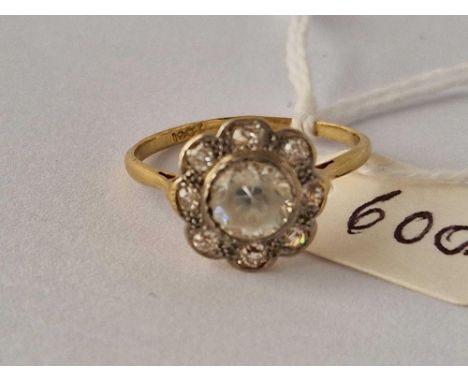 A cluster ring with diamond boarder and white central stone 18ct gold size Q 2,7 gms