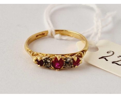 A seven stone ruby and diamond ring 18c gold size N 2.3 gms
