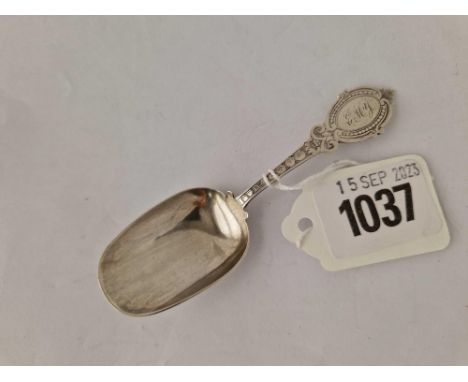 A Victorian caddy spoon with engraved handle Birmingham 1876 by G U