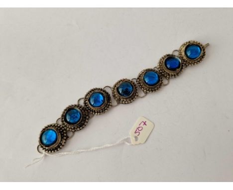 A silver and eight panel blue stone antique bracelet