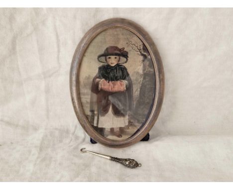 An oval photo frame modern, 5.5" high and a small button hook