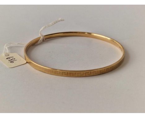 A rolled gold bangle