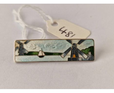 A silver and enamel windmill scene brooch