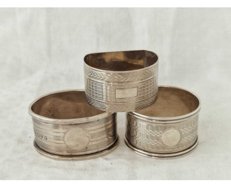 Three engine turned napkin rings with no initials. Birmingham 1933 etc 44gms