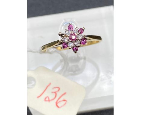 A ruby and diamond cluster ring 9ct