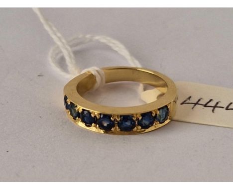 A seven stone sapphire half eternity ring 18ct gold size N 5.4 gms