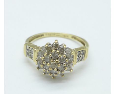 A 9ct gold and diamond ring, 0.5ct stamped on shank, 2.7g, M