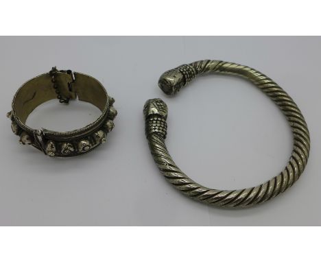 A bangle and a large heavy novelty torq 'bangle'