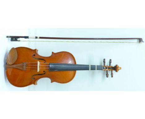 A cased Stentor student's violin and bow, length of back excluding button 31.5cm