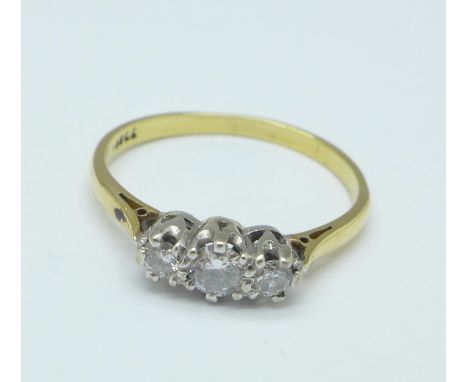 An 18ct gold and three stone diamond ring, 1.9g, M