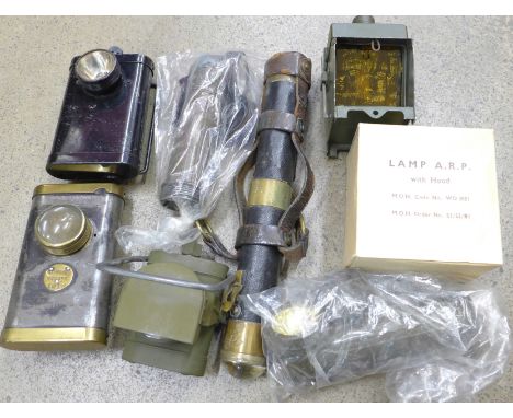 A collection of lamps and torches; a WWI Ever Ready lamp and Efandem Co. Ltd trench torch, a Joseph Lucas electric lamp No.1,