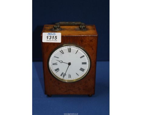 A boxwood cased Arts and Crafts type Mantle Clock, the case decorated with trailing Ivy, and having an enamelled face with Ro