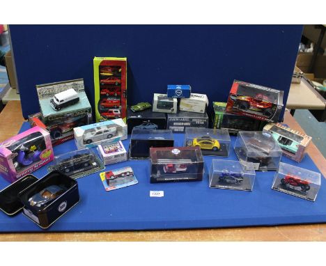 A box of Die-cast model vehicles including '007' Chevrolet Corvette, Formula 1 cars, British Challenger tank etc