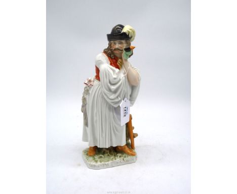 A Herend hand painted figure of a man in traditional dress leaning on a stick with a pipe in his hand, 11 1/2'' tall.