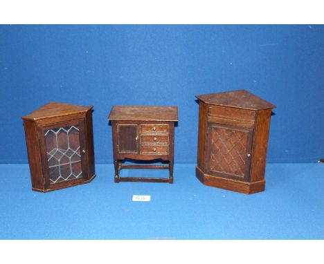 Three model Apprenticeship pieces including leaded window corner cupboard, another corner cupboard and sideboard with three d