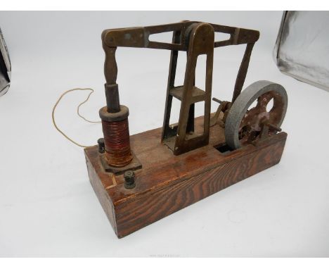 A fascinating electro-magnetically driven miniature Beam Engine mounted on an Oak base and having screw-down terminal connect