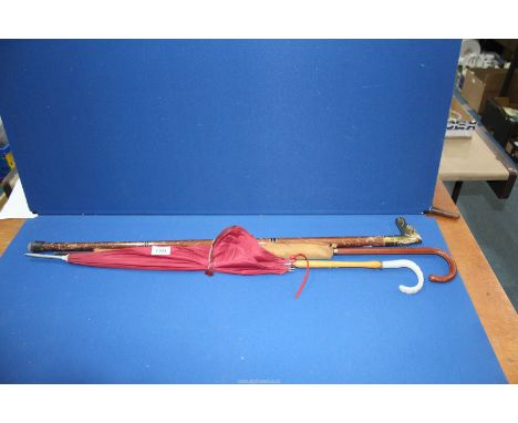 Two vintage ladies umbrellas and a three piece walking stick with brass horse head handle.