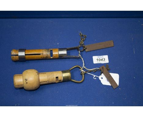 Two vintage snooker/billiard cue holders with integrated tip sharpeners.