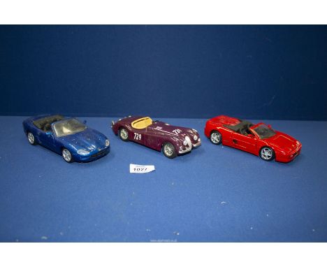 Three 1/24 scale model cars including Maisto Ferrari F355 and Jaguar XK8 plus Burago 1948 Jaguar XK120.