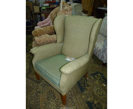 A Wing Fireside Armchair upholstered in lattice patterned green upholstery - Parker Knoll model No. 711 -1947.