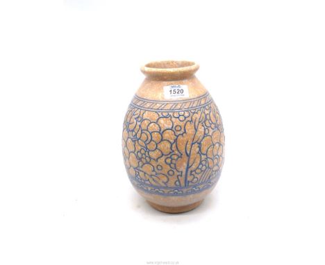 A Charlotte Rhead Pottery vase in muted orange and blue with floral tube lined decoration, 10" tall.