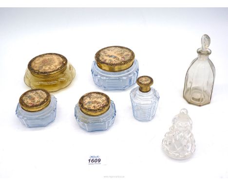 A dressing table set with tapestry inset lids and two perfume bottles with stoppers.