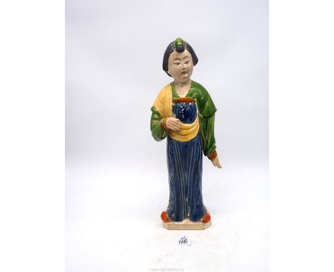 A Chinese pottery figure after a model of a Court lady from the Tang dynasty, 16 1/2" tall.