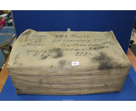 A metal travel case with canvas cover belonging to 'Mr L. Smith'. Len Smith enlisted in the Army at just aged 15 pretending t