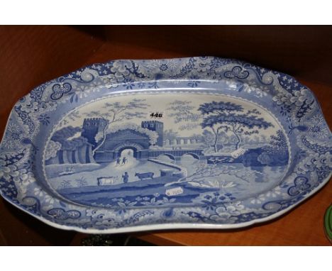 A LARGE 19TH CENTURY SPODE MEAT PLATTER, blue and white transfer castle pattern, figures passing through gateway to bridge be